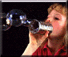 Kid blowing bubbles with a tin can.